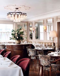 a dining room filled with lots of tables and chairs