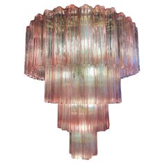 a pink glass chandelier hanging from the ceiling