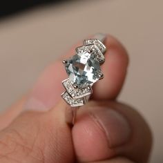 This is a gorgeous handmade creation. Its beauty is its simplicity & Elegance. The 7*7mm cushion cut faceted natural Aquamarine is crafted in solid sterling silver and with rhodium plated. All item is sent in a beautiful gift box If you have any idea of design your ring,pls contact me directly. You can realize more lovely stuff clicking the link https://www.etsy.com/shop/knightjewelry?refshopsection_shophome_leftnav Please leave the correct address and you phone number for delivering success Asscher Cut Gemstone Ring In 14k White Gold, Silver Cushion Cut Topaz Ring With Diamond Accents, Sterling Silver Rings With Diamond Accents, Cushion Cut, Sterling Silver Asscher Cut Topaz Ring, Sterling Silver Topaz Ring Asscher Cut, Blue Topaz Cushion Cut Diamond Ring, Aquamarine Diamond Cut Rings In Fine Jewelry Style, Aquamarine Diamond Cut Rings Fine Jewelry, Cushion Cut Blue Topaz Rings With Diamond Accents