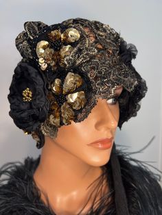 "This is flapper hat cloche has my handmade design is in version of my vintage collection 1920's style hats. I add a flavor of Elizabeth's, 20's and Modern Era, looks elegant and feminine. Made from black golden lace  embroidery golden metallic, adorned floral, tassel on one side, fully stitching by my hand.   Measurement hat inside 24\". Fabric is not stretchy. Mannequin's head about 22''. Show your beautiful personality, it's like outfit can't be complete without Special Hat. This unique one o Bohemian Gold Party Hat, Gold Bohemian Party Hat, Adjustable Embroidered Party Hat, Elegant Embroidered Adjustable Hat, Winter Party Vintage Fascinator, Bohemian Cap Costume Hats And Headpieces For Party, Winter Flapper Style Cloche Hat, Handmade Vintage Cloche Hat, Bohemian Fitted Party Hats