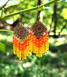 Handmade Orange Festival Earrings, Handmade Orange Earrings For Festivals, Bohemian Orange Drop Earrings, Artisan Orange Beaded Earrings, Bohemian Orange Beaded Earrings For Gifts, Handmade Bohemian Amber Earrings, Orange Beaded Drop Earrings For Festival, Handmade Adjustable Amber Earrings, Handmade Amber Bohemian Earrings