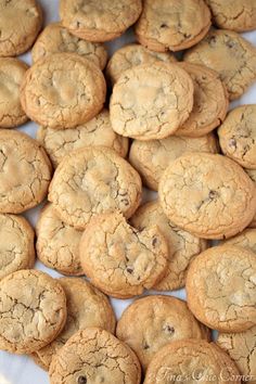 a pile of cookies sitting on top of a white plate