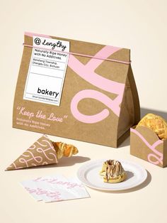 a box of baked goods sitting on top of a table next to it's packaging