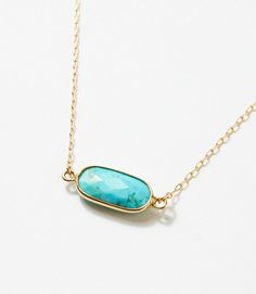 Effortlessly transition from everyday wear to special occasions in this subtle and low-profile genuine turquoise necklace. The gold bezel setting not only enhances the beauty of the turquoise but also adds a luxurious touch to the overall design. Dimensions: 7.5-9.5" adjustable length, pendant size 1 cm Material: 14k gold-filled, lead and nickel-free chain Weight: 0.52oz Lobster clasp closure Handmade in USA Turquoise And Gold Necklace, Modern Turquoise Jewelry, Turquoise And Gold Jewelry, Gold Turquoise Jewelry, Gold And Turquoise Jewelry, Turquoise Jewelry Western, Turquoise Jewelry Necklace, Teal Jewelry, Turquoise Bar Necklace