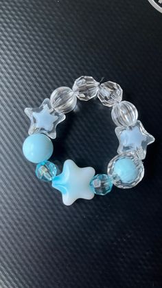 Blue star child size bracelet. Blue Beaded Bracelets With Star Charm For Gift, Blue Bracelet With Star Charm As Gift, Blue Bracelets With Star Charm And Round Beads, Blue Handmade Star-shaped Beaded Bracelets, Blue Bracelets With Star Charm For Gift, Blue Star Charm Bracelet, Trendy Blue Star-shaped Jewelry, Trendy Star-shaped Blue Jewelry, Blue Beaded Bracelets With Star Charm