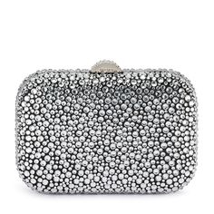 With its curved lines and glossy hardware, the Casey Hot Fix Encrusted Clutch is a total show stopper. The rounded square shape fits comfortably in the palm of your hand. Wear it as a shoulder bag or wear it as a clutch by tucking the shoulder chain inside. W18cm x H12cm x D6cm Shoulder chain drop length 50cm Encrusted block lock closure Removable shoulder chain Fits a smart phone Luxury Silver Bags For Cocktail, Luxury Silver Cocktail Evening Bag, Chic Sparkling Rectangular Clutch, Luxury Silver Clutch For Cocktail, Luxury Silver Clutch For Cocktail Events, Luxury Silver Cocktail Clutch, Luxury Silver Clutch For Night Out, Silver Sparkling Evening Clutch, Glamorous Silver Clutch For Cocktail