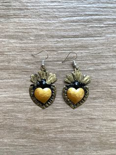 "Mexican tin heart earrings Beautiful hand painted earrings by talented artisans in Mexico. Heart earrings size: 1.5\" All orders are shipped using Mexican Postal Service and it takes: 15-25 bussines days (North America). 20-30 bussines days (Europe). 20-35 bussines days (Rest of the world). If your are in a hurry or if you would like to use another shipping service, please contact me before placing your order. The extra cost is calculated according to the package dimension and weight." Hand Painted Heart Earrings For Gift, Hand Painted Heart Earrings For Valentine's Day Gift, Heart-shaped Hand Painted Earrings As Gift, Nickel-free Brass Heart Earrings, Artisan Heart-shaped Hand Painted Jewelry, Artisan Hand Painted Heart Jewelry, Artisan Hand-painted Heart Jewelry, Artisan Heart Earrings As Gift, Artisan Heart Earrings For Pierced Ears As Gift