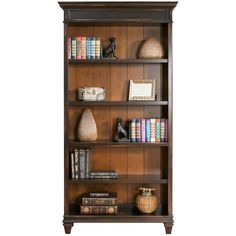 a wooden bookcase with books and vases on it's shelves, against a white background