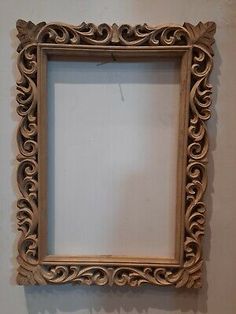 an old wooden frame hanging on the wall