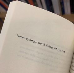 an open book with the words not everything is worth fixing move on written in black