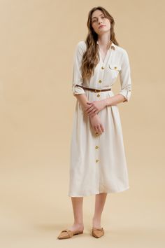 Get ready to stand out in the Monica Midi Dress, featuring a collared neckline and button down front. With gold buttons and hardware, this dress comes complete with a belted waist and pintuck details for a flattering silhouette. The long sleeves with cuff and tab detail, along with the midi length, make this a versatile shirt dress for any occasion. Plus, it even has pockets for added convenience! Chic Button-up Belted Dress For Fall, Chic Fall Belted Button-up Dress, Fall Collared Belted Dress With Belted Cuffs, Elegant Workwear Dresses With Gold Buttons, Chic Button-up Belted Dress With Belted Cuffs, Chic Belted Dress With Button-up Cuffs, Chic Belted Dress With Button-up And Belted Cuffs, Elegant Work Dresses With Gold Buttons, Elegant Dresses With Gold Buttons For Work