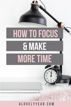 a desk with a lamp, clock and laptop on it that says how to focus & make more time