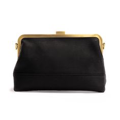 An iconic black clutch purse for your unforgettable nights. This evening clutch was Designed to fit perfectly inside of your Bobobark or Trolala, it has a central divider, 2 wide compartments, 2 zip pockets, a card slot and enough room to elegantly carry your essentials from the evening and until the next morning. Comes with both our classic black cork strap and our brass chain strap for comfortable over-the-shoulder wear. Black Evening Clutch With Fold Over Clasp, Clutch Essentials, Black Pouch Evening Bag With Gold-tone Hardware, Black Clutch With Gold-tone Hardware For Evening, Leather Evening Clutch With Gold-tone Hardware, Cork Clutch, Elegant Black Hand-embellished Clutch, Clutch Purse Black, Clutch Purse Evening