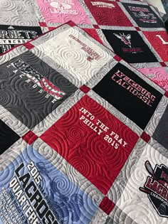 a quilt made to look like it has many different logos on the front and back