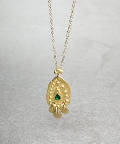 Boho gold necklace 9k 14 k Solid gold necklace with green emerald May birthstone, Yellow gold necklace, Delicate Pendant, Gift for her This solid gold necklace has a rustic textured and is set with a natural green emerald. The pendant has a delicate granulation all around it. This pendant is delicate but has a lot of character, and will upgrade any outfit you'll wear, for everyday use, as for special occasions The pendant can be ordered without the chain too. An excellent choice for anniversary Gold Emerald Necklace With Delicate Chain, Fine Jewelry, Fine Jewelry Gold Emerald Necklace With Delicate Chain, Gold Emerald Necklace With Delicate Chain For Gift, Gold Gemstone Necklace For May Birthstone, 17 Jewels Gold Plated Emerald Necklace As Gift, Fine Jewelry Gold Emerald Necklace In Sterling Silver, Emerald Necklace With Delicate Yellow Gold Chain, Dainty Gold-plated Emerald Necklace, Yellow Gold Emerald Necklace With Delicate Chain