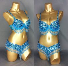 two mannequins with blue beads and chains on their backs, one in the shape of a bathing suit