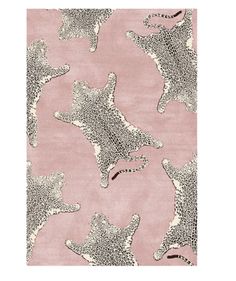 a pink rug with black and white leopards on it's side, in front of a light pink background