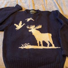 a sweater with an image of a moose on it