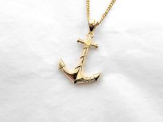 men's anchor necklace pendant 1 made in 14k solid gold or 18k solid gold this is the anchor entwined by a rope necklace pendant with exquisite details. - model wears a 2.1mm chain 60cm. - materials: real 14k solid gold, real 18k solid gold - free shipping on all orders - designed by carre d'or - made in south korea 14k gold anchor pendant necklace weight pendant only 8.03g (±3%) with a 2.1mm chain 42cm 13.99g (±3%) with a 2.4mm chain 42cm 15.86g (±3%) with a 3.0mm chain 42cm 19.61g (±3%) 18k gol Mens Necklace Gold, 14k Gold Anchor Necklace As Gift, Anchor Necklace Men, Gold Anchor Necklace In Nautical Style, Anchor Locket Gold, Anchor Pendant Gold, Men's Necklace Gold, Gold Nautical Anchor Necklace, Anchor Pendant