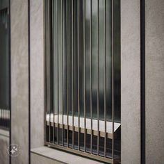 a window with bars on the side of it