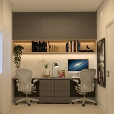 two white office chairs sitting in front of a computer desk