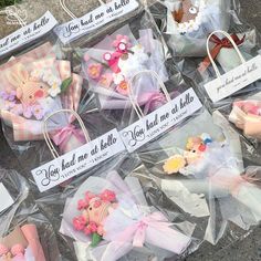 some little baskets with small items in them on the ground