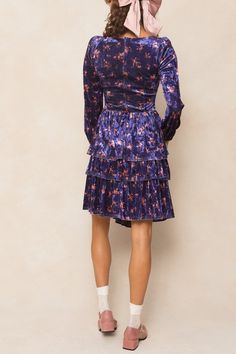 Introducing the Nikki Dress! This stunning knee-length dress features a gorgeous purple velvet fabric with pink florals throughout, giving it a romantic and luxurious feel. The sweetheart neckline and long flowy sleeves add a touch of elegance, while the hidden back zipper and elastic wrist closure make it easy and comfortable to wear. Perfect for any occasion (including the Eras Tour!). Purple Knee-length Winter Dress, Fitted Velvet Dresses With Floral Print, Velvet Mini Dress For Spring, Purple Knee-length Midi Dress For Fall, Mini Velvet Dresses For Fall, Purple Floral Print Knee-length Mini Dress, Purple Floral Dress For Party, Purple Velvet Dress For Party, Purple Velvet Party Dress