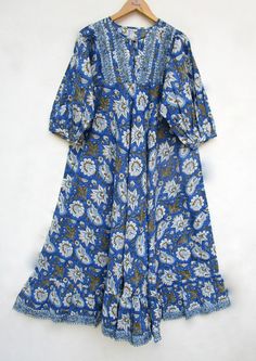 ITEM DESCRIPTION cotton royal blues printed long maxi dress - Henley neckline with buttons summer maxi dress  - 3/4th sleeve with button dress Features: 3/4th sleeve, Henley neck, Long dress Fabric : 100% Cotton cambric hand block print fabrics   Sleeve Length = 18 inch For more sizes & their measurement, please refer our below chart to understand the sizes variations available with us For your size requirement, please mention your size in seller note at the time of buying. SIZE MEASUREMENT  BUSTLENGTHSHOULDER XXS34 inch51 inch13.5 inch XS36 inch51 inch14 inch S38 inch51 inch14.5 inch M40 inch51 inch15 inch L42 inch51 inch16 inch XL44 inch51 inch16.5 inch 2XL46 inch51 inch17 inch 3XL48 inch51 inch18 inch   Company Return Policy:  Please write for more information to my email directly CHOOS Button Maxi Dress, Ethnic Print, Maxi Robes, Blue Hand, Block Printing Fabric, Summer Maxi, Button Dress, Summer Maxi Dress, Long Maxi