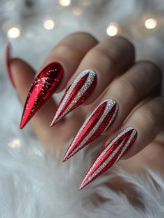 Holiday Stilleto Nails Designs, New Years Eve Nails Stiletto, Christmas Gift Nails Design, Red Nails With Silver Glitter Ombre, Christmas Nail Design Stiletto, Candy Cane Stiletto Nails, New Years Nails Coffin Long, Holiday Nails Coffin Shape, Modern Holiday Nails