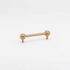 an image of a pair of brass barbells