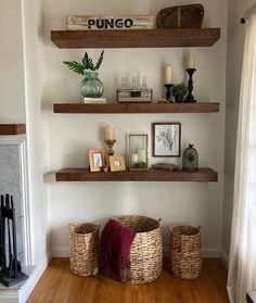 some shelves with baskets and pictures on them