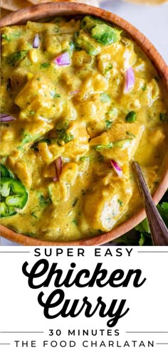 a bowl filled with chicken curry and broccoli on top of a white table