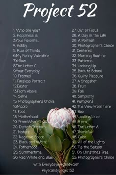 a blackboard with the words project 52 written on it and a flower in front