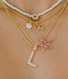 Icy & Luxe! Our statement initial necklace features a jumbo-sized, 14K Gold-plated blingy CZ letter pendant set on a hypoallergenic (allergy-free) Gold-plated ball chain necklace made of hypoallergenic brass metal. Perfectly dainty and lightweight. Choose your frosty initial from the drop down. Limited supply only. Preppy Gold Necklaces, Preppy Jewelry Necklaces, Necklace Stacking Gold, Gold Necklace Stack, Necklace Stacks, Summer Jewelry Trends, Lucky Charm Necklace, Necklace Stack, Preppy Jewelry