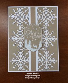 a card with snowflakes on it that says let it snow