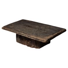 an old wooden table that has been turned into a coffee table with a square top