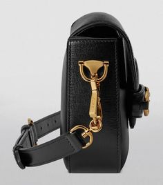 This mini iteration of Gucci’s Horsebit 1955 bag may be petite in size, but it makes as much of an impact as its larger styles. The double ring and bar design spotlighted on the front is one of the brand’s signature borrowings from the equestrian world, a detail that has become part of the House’s code – it’s as recognisable as the Web stripe that adorns the strap. Modern Evening Bag With Horsebit Detail, Modern Evening Bags With Horsebit Detail, Rectangular Shoulder Bag With Horsebit Detail For Everyday Use, Evening Rectangular Shoulder Bag With Horsebit Detail, Gucci Rectangular Shoulder Bag With Horsebit Detail, Rectangular Gucci Shoulder Bag With Horsebit Detail, Gucci Satchel Shoulder Bag With Horsebit Detail, Modern Gucci Bags With Horsebit Detail, Gucci Classic Satchel With Branded Hardware