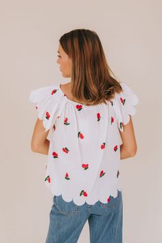 Get ready to fall in love with our Cherry Lover Top! This off-white shirt features delicate embroidered cherries, scalloped edges, and flutter sleeves for a playful touch. Made with sheer material and an elastic boat neckline, this top is both feminine and fun. (Cherry-picked perfection!) Details Off-white shirt with embroidered cherries Scalloped edges Flutter sleeves Sheer material Elastic boat neckline Sizing Approximate measurements: SIZE LENGTH BUST Small 23" 40" Medium 23.5" 42" Large 24" Embroidered Cherries, Nursing Friendly Tops, Nursing Friendly Dress, Plus Jumpsuit, Exclusive Dress, Maternity Shops, Sheer Material, Basic Dress, Top Top