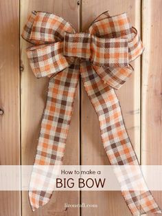 an orange and brown plaid bow hanging on a wooden door with text overlay that says how to make a big bow