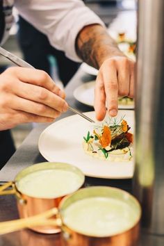 a person is cutting up some food on a plate