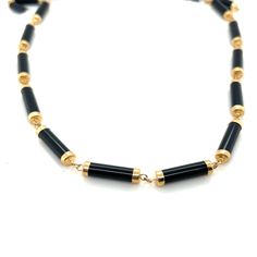 "Yellow Gold Black Onyx Necklace Perfect for everyday wear a special occasion and makes the perfect gift.  Details:                  14KT Yellow Gold                16\" Long                 Weight 13.5 Grams                Onyx Measures 4mm X 15mm                 Comes in a presentable gift box" Classic Black Necklace For Formal Occasions, Formal Onyx Necklace With Black Enamel, Black Jewelry With Adjustable Chain For Formal Occasions, Formal Black Onyx Necklace, Black Single Strand Necklace For Gift, Black Enamel Necklace For Evening, Black Single Strand Necklace, Black Jewelry With Lobster Clasp And Round Shape, Black Round Jewelry With Lobster Clasp