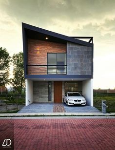 a car parked in front of a modern house