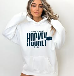 a woman wearing a white hoodie with the words team name harvy hunk on it