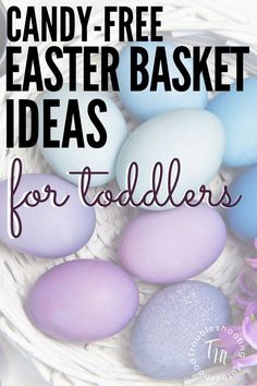 a basket filled with easter eggs and the words candy - free easter basket ideas for toddlers