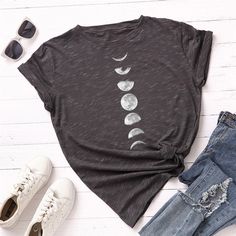 We love a comfy-meets-edgy ‘fit which is exactly what you’ll get with the Eclipse Graphic Tee! This cute top is formed from lightweight jersey knit and formed to a classic crew neckline framed by short sleeves. Pair with your favorite blue jeans and some sassy sunnies for a trendy and laid back look! 100% Cotton. Fit: Fitted Design. Order one size up based on feedback. Length: Size small measures 24″ from shoulder to hem. Bust: Great for any cup size. Machine Wash Cold - lay flat dry Winter Self Care, Earth Photo, Galaxy Style, Light Beach, Moon Planet, Moon Graphic Tee, Stars Space, Woman Shirt, Modern Witch