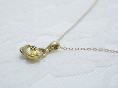 Gold flower necklace- simple dainty necklace Three petal flower charm hangs on a dainty 14K gold filled chain. Simple and dainty jewelry, a great everyday necklace. measurements Charm- approx. 16mm with loop Material - charm/gold plated chain and all other findings/gold filled Looking for gold necklaces? http://www.etsy.com/shop/illusy?section_id=10992854 ♦you can enter shop here! http://etsy.com/shop/illusy Dainty Yellow Gold Flower Necklace, Gold Dainty Flower Pendant Necklace, Dainty Gold Flower Pendant Necklace, Dainty Yellow Gold Flower Necklace With Clavicle Chain, Delicate Yellow Gold Flower Necklace With Delicate Chain, Delicate Gold Flower Charm Necklaces, Delicate Gold Charm Necklaces With Flower Shape, Delicate Gold Pendant Flower Necklace, Minimalist Gold Flower Necklace With Delicate Chain