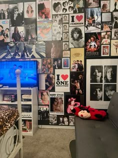 a living room filled with furniture and lots of pictures on the wall next to a flat screen tv