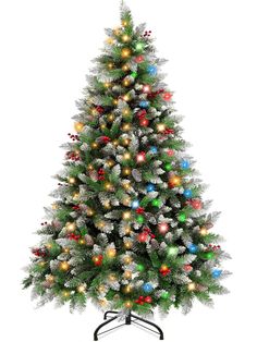 a white christmas tree with multicolored ornaments on it's base and a black stand