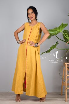 "Women Cotton dress, a Sleeveless yellow boho dress with split long Sundress loose Robes casual Shirt Dress with pockets PRODUCT SIZE : One Size * Chest : max 38\" * Waist : max 40\" * Hips : up to 52\" * Length : 52 from shoulder to hem * Armhole : 20\" * Shoulder to shoulder : 13 NOTE : * Model chest : 32\", waist : 24\" hips : 35\" * Combined Height is 5\"6 > I'm 5\"2 (158cm) and I'm wearing 4\" heels in the pictures MATERIAL * Cotton (does not stretch) * Accessories excluded * As this is a s Sleeveless Summer Dress With Back Tassel Tie-up, Bohemian Sleeveless Maxi Dress With Back Tassel Tie-up, Sleeveless Tassel Maxi Dress For Vacation, Sleeveless Tasseled Maxi Dress For Summer, Casual Maxi Dress With Tassels For Festival, Casual Festival Maxi Dress With Tassels, Bohemian Floor-length Dress With Side Slits, Cotton Maxi Dress With Side Slits, Long Maxi Dress With Tassels