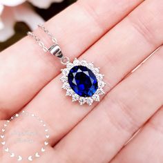 ''Hand made 3-carat eq. (8*10 mm) Royal Blue oval cut lab sapphire pendant, with brilliant cut white diamond simulant halo/cluster setting, come with chain. '' Unique on Etsy!  This is a breathtakingly beautiful necklace with a stunning Royal Blue coloured lab sapphire centre stone!  When we first saw the finished sapphire cut we were over the moon! Our lab grown sapphire has the same chemical composition (mineral corundum), optical appearance and physical characteristics (Mohs scale 9) as top q Princess Diana Engagement Ring, Herzogin Von Cambridge, Physical Characteristics, Blue Sapphire Necklace, Mohs Scale, Sapphire Pendant, Diamond Simulant, Birthstone Gifts, Matching Rings